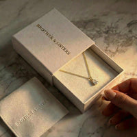 Thumbnail for Astra Teardrop Necklace displayed in a Brother & Sisters box with soft lighting.