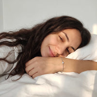 Thumbnail for Heart Bond Matching Bracelet Set in Silver — worn on her wrist on a lazy morning in bed