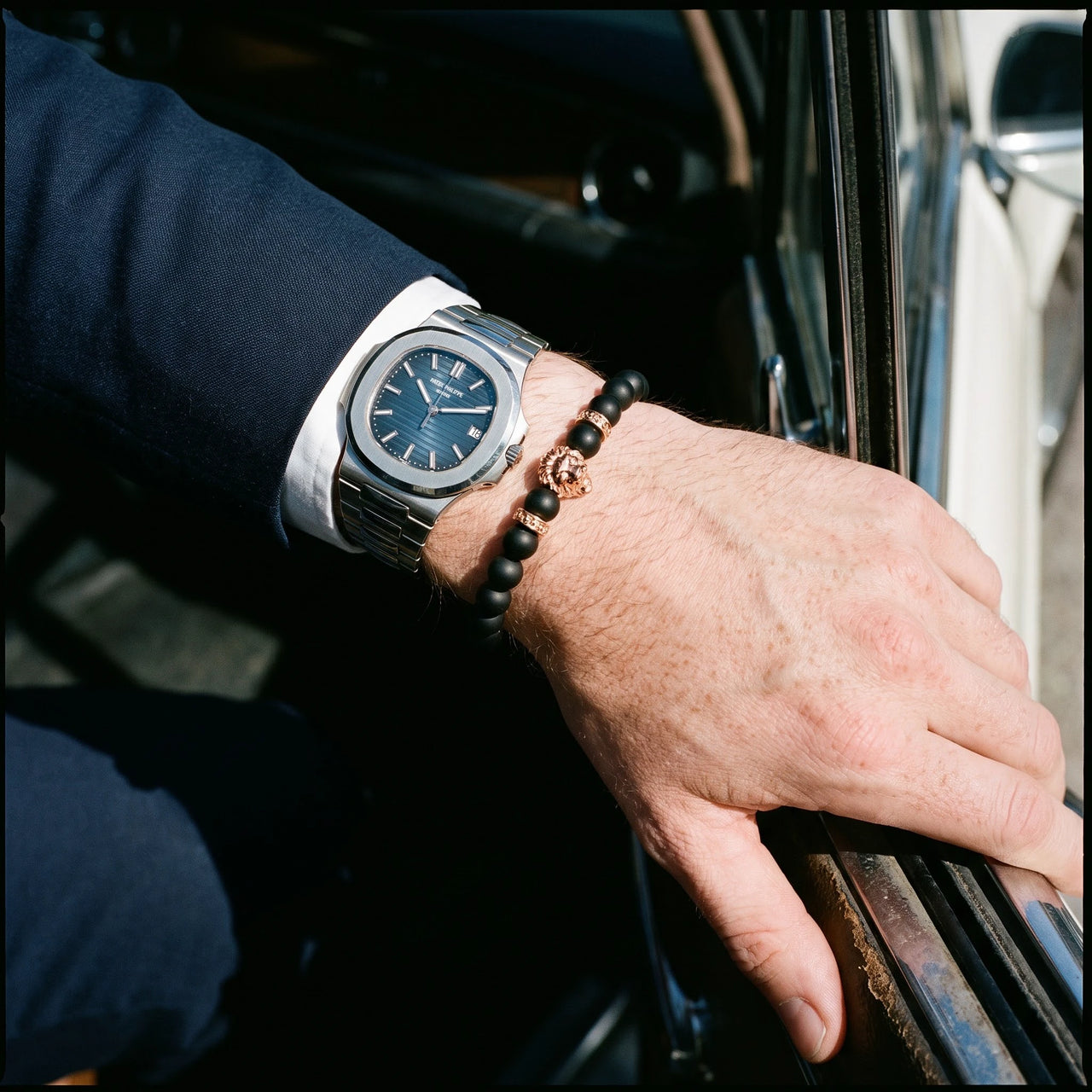 Rose Gold Lion & Black Stones Bracelet – worn next to a luxury watch | Brother & Sisters | SKU: 20712286-rose-gold-XS-14-15, 20712286-rose-gold-S-16-17, 20712286-rose-gold-M-18-19, 20712286-rose-gold-L-20-21, 20712286-rose-gold-XL-22-23