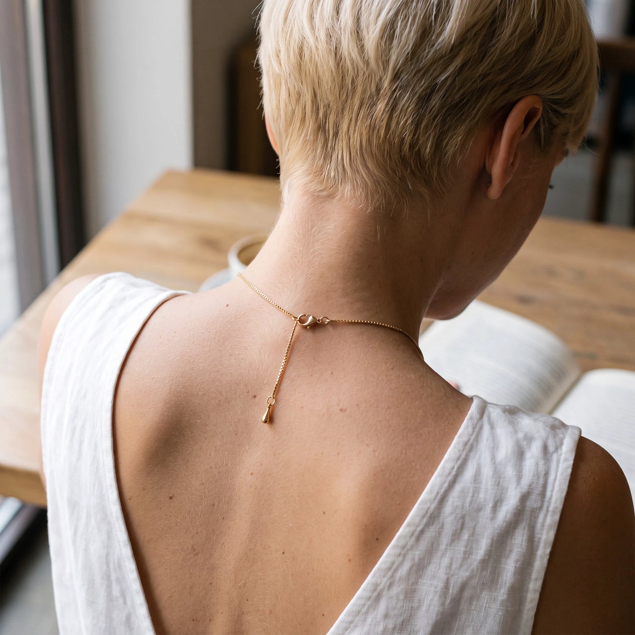 Back of the neck showing the clasp and extension chain of the gold drop photo necklace | SKU: TPH-DRPN-GOLD